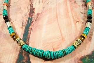 Genuine Turquoise Necklace with Genuine Spiny Oyster Shell, Black Onyx, Tiger's Eye and Blue Lapis Accents. Sterling Silver & Gold Fill Barrels, Sterling Silver Beads and Clasp. Created by Navajo Artist Tommy Singer. Signed by the artist.